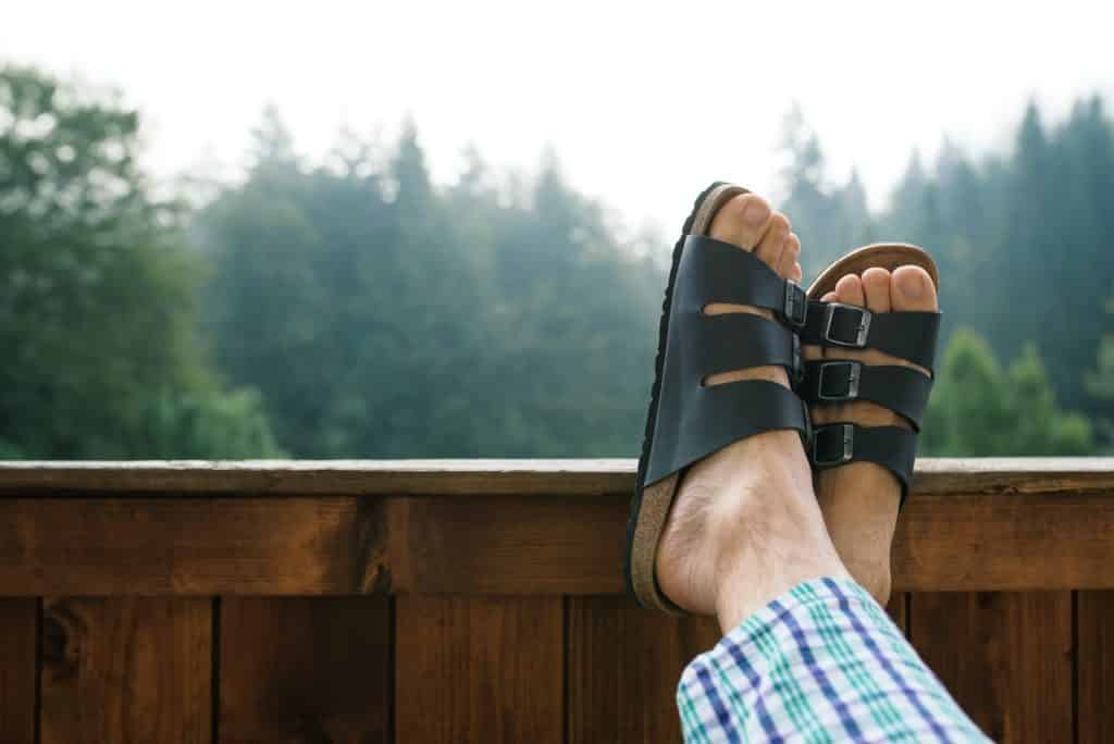 Relaxing at hotel balcony in misty morning